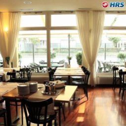 Sala colazione nel ristorante Astoria Swiss Quality Hotel Fotos