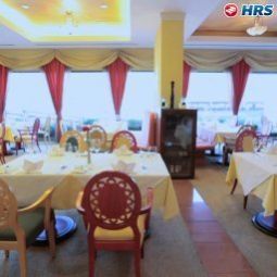 Salle du petit-déjeuner située dans le restaurant President Fotos