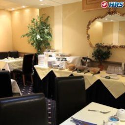 Sala de desayuno en el restaurante Quality Crown Hyde Park Fotos