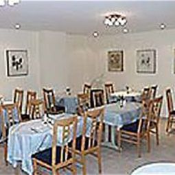 Sala de desayuno en el restaurante Plaza Fotos