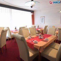Sala de desayuno en el restaurante Stadthotel - Garni Fotos