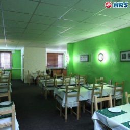 Salle du petit-déjeuner située dans le restaurant Hotel-U Fotos