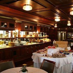 Sala colazione nel ristorante Elite Residens Fotos