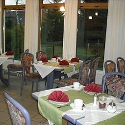 Sala colazione nel ristorante Port Inn Fotos