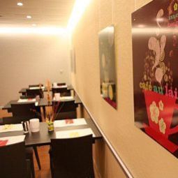 Salle du petit-déjeuner Ambassador Garni Fotos