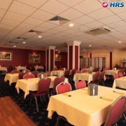 Sala colazione nel ristorante Rushotel Fotos
