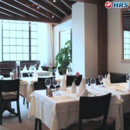 Salle du petit-déjeuner située dans le restaurant Alfa Fotos