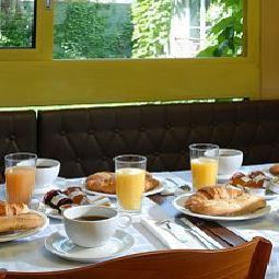 Salle du petit-déjeuner Berlioz Fotos