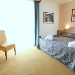 Camera Ambassador Suite Hotel Fotos
