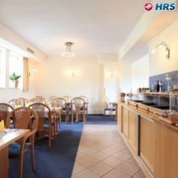 Salle du petit-déjeuner située dans le restaurant Am Segelhafen Fotos