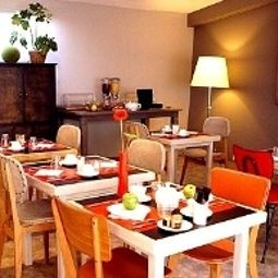Salle du petit-déjeuner Edmond Rostand Logis Fotos