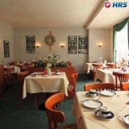 Salle du petit-déjeuner située dans le restaurant Zum Harzer Jodlermeister Pension & Restaurant Fotos