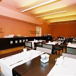 Salle du petit-déjeuner située dans le restaurant Eurostars David Fotos