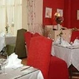 Salle du petit-déjeuner située dans le restaurant Butlers Townhouse Fotos