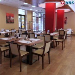 Sala de desayuno en el restaurante Regnum Residence Fotos