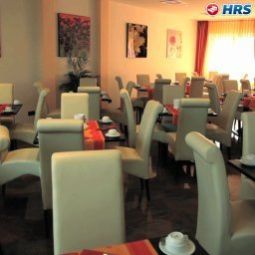 Sala colazione nel ristorante Grand Hotel Dream Main City Center Fotos