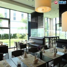 Salle du petit-déjeuner située dans le restaurant Worldhotel - The Rilano München Fotos