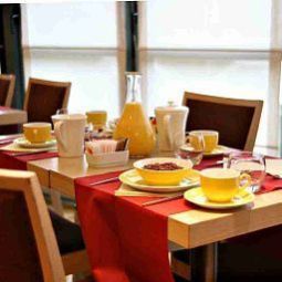 Sala de desayuno Best Western Palace Inn Fotos