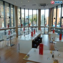Salle du petit-déjeuner située dans le restaurant Sleeperz Fotos