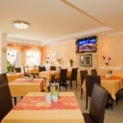 Salle du petit-déjeuner située dans le restaurant Residenz zum Südstrand Fotos