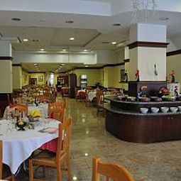 Sala de desayuno en el restaurante Innocenti Fotos