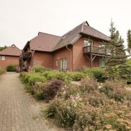 Фасад Ferienanlage Lobbe Fotos
