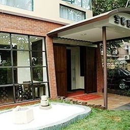 Vista esterna Baolong Home Hotel Wujiaochang Fotos