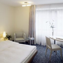 Chambre pour voyageurs d'affaires Mövenpick Fotos
