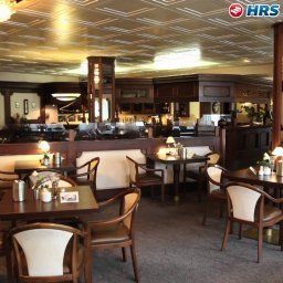 Sala colazione nel ristorante Königshof Garni Fotos