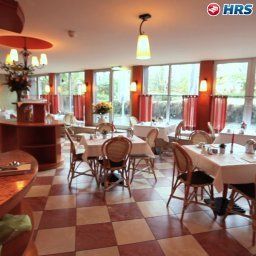 Salle du petit-déjeuner située dans le restaurant Michels Apart Fotos