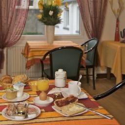 Salle du petit-déjeuner située dans le restaurant Hotel du Midi Charme & Affaires Fotos