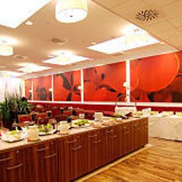 Salle du petit-déjeuner située dans le restaurant Airo Tower Fotos