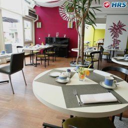 Salle du petit-déjeuner située dans le restaurant Domicil Leidinger Fotos