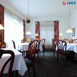Salle du petit-déjeuner située dans le restaurant Cityhotel Hessischer Hof Fotos