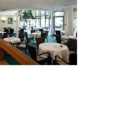 Salle du petit-déjeuner située dans le restaurant Haus am Meer Fotos