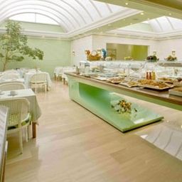 Sala de desayuno en el restaurante Lleo Fotos