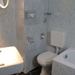 Camera da bagno Alfa Gold Inn Fotos
