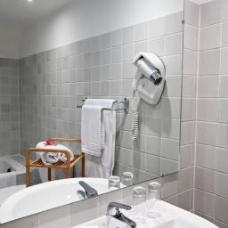 Camera da bagno Hôtel Suisse Fotos