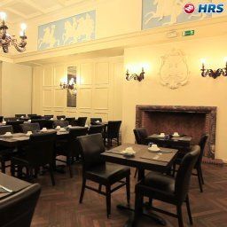 Salle du petit-déjeuner située dans le restaurant Colonies Fotos
