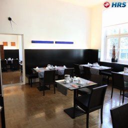 Salle du petit-déjeuner située dans le restaurant ABC-Hotel Garni Fotos