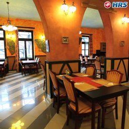 Salle du petit-déjeuner située dans le restaurant Best Western Janus Boutique Fotos