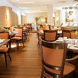 Salle du petit-déjeuner située dans le restaurant Welcome Fotos