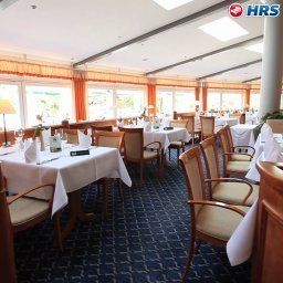 Salle du petit-déjeuner située dans le restaurant Schlossmühle Fotos