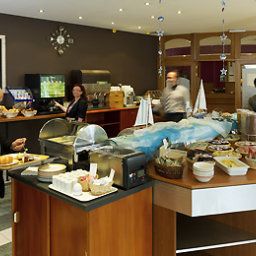 Salle du petit-déjeuner située dans le restaurant ibis Charleroi Aéroport Fotos