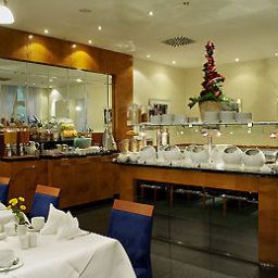 Salle du petit-déjeuner située dans le restaurant Mercure Hotel & Residenz Berlin Checkpoint Charlie Fotos