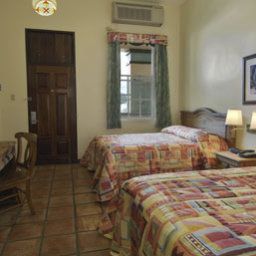 Camera Howard Johnson Inn Downtown Mayaguez PR Fotos