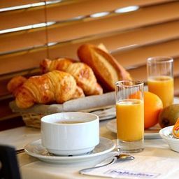 Salle du petit-déjeuner Balladins Tourotel Fotos