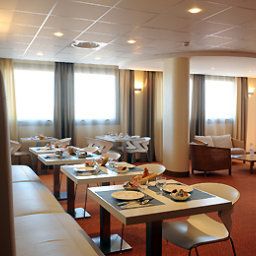 Salle du petit-déjeuner située dans le restaurant Adagio Toulouse Parthenon Fotos