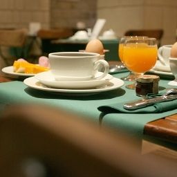 Sala de desayuno en el restaurante Tilsitt Etoile Fotos