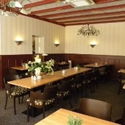 Salle du petit-déjeuner située dans le restaurant De Magneet Fotos